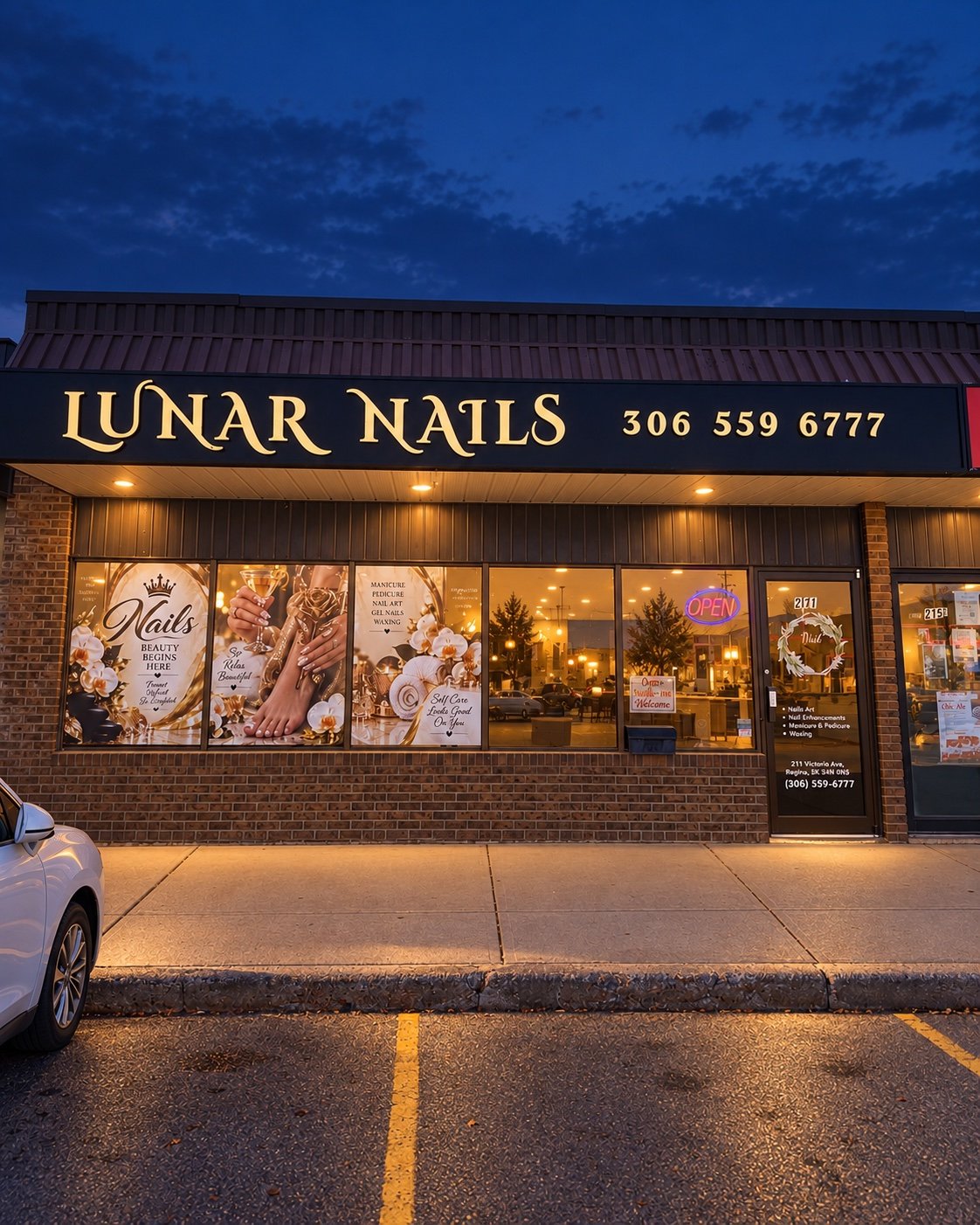 Lunar Nails storefront and illuminated sign at dusk
